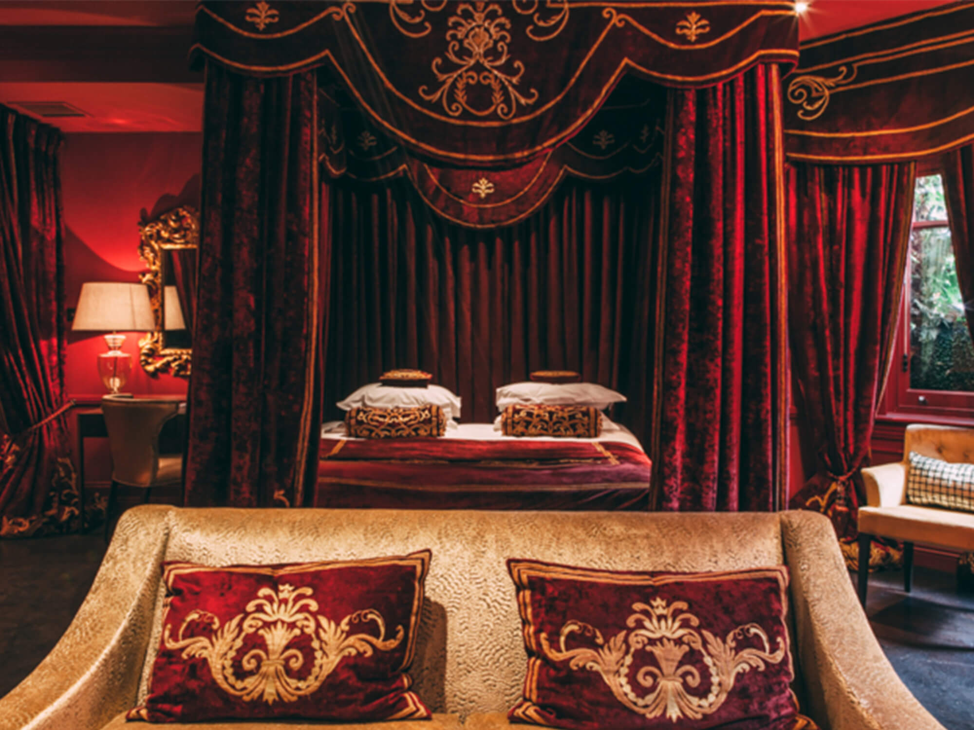 Couch and bed inside the Signature Suite at 11 Cadogan Gardens