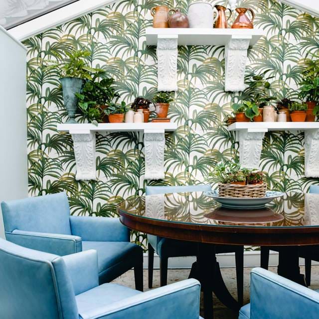 Seating area inside the conservatory at 11 Cadogan Gardens