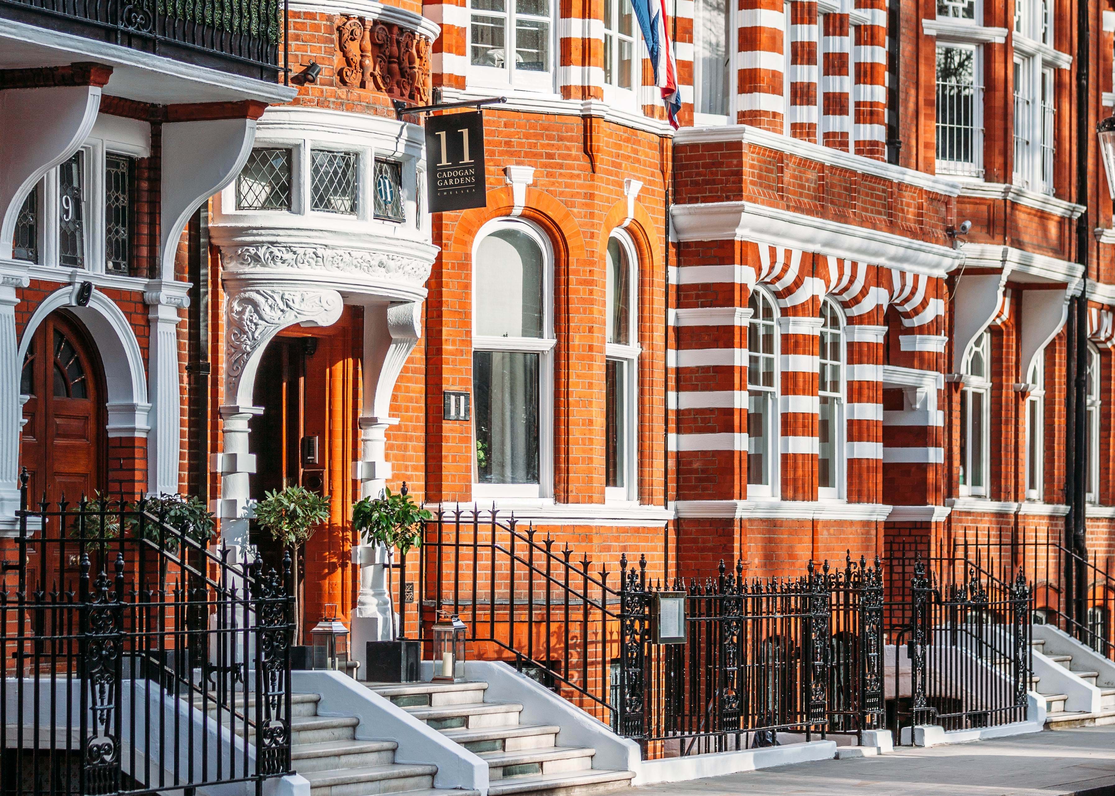 Hotel in London with red brick exterior and Union Jack flag above entrance