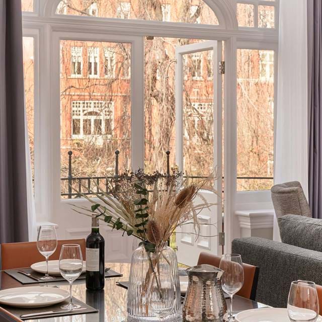 Dining table with view from apartment at 11 Cadogan Gardens
